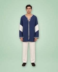 DRISSI, genderless tunic worn, front view on a green background
