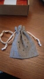 Petite housse pied-de-poule fournie avec les articles Idrissi's brand